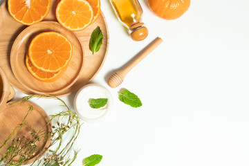 summer orange fruit citrus with wood dinner dish and cosmetic spa lotion facial cream for skin...