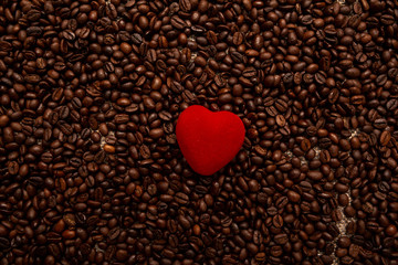 Red heart on roasted coffee beans. Love for coffee. opy Space