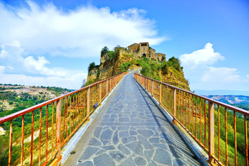 View of Civita village located on a hill and connected with Bagnoregio town by a bridge in central...