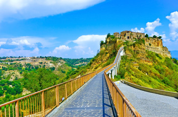 Fototapeta na wymiar View of Civita village located on a hill and connected with Bagnoregio town by a bridge in central Italy.