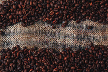 Coffee beans and sackcloth background., place for text