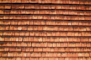 A detail of the traditional wooden house in scandinavia with its red colored planks. The color is called 