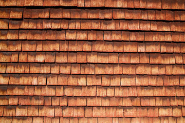 A detail of the traditional wooden house in scandinavia with its red colored planks. The color is called "falun red". 