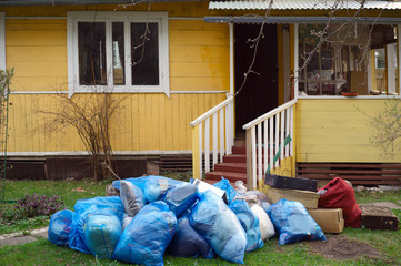 Pile of rubbish in front of house