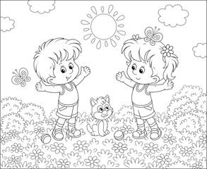 Cheerful little kids doing morning exercises among flowers on a lawn on a sunny day, black and white vector illustration in a cartoon style for a coloring book