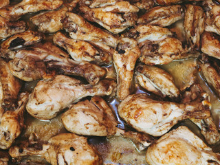 Obraz na płótnie Canvas Roasted chicken wings on background