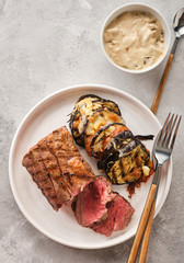 Veal tenderloin with vegetables, eggplants and tomatoes with demi-glace sauce.