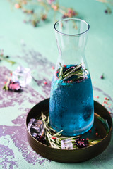 Cold Curacao Lemonade with Rosemary and Blackberry.