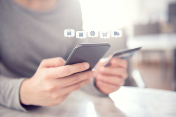 Close up hands holding credit card and using mobile smart phone with icon Online shopping, E-Commerce.