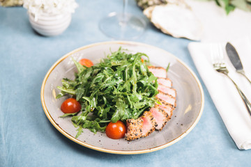 fried tuna with arugula and cherry tomatoes