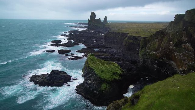 Londrangar in Snaefellsnes National Park, Iceland. Londrangar and hill Svalthufa are remains of a crater, which has been eroded to present form by sea. It is the tourist destination of west Iceland.