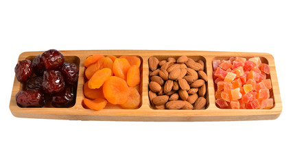 Mix of dried fruits and nuts. Apricot, raisin, cranberry, dates fruit. Isolated on a white background. Space for text or design.
