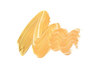 Gold stroke of the paint brush isolated on white background