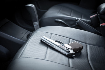 the gun is on the car seat. criminal district of the city