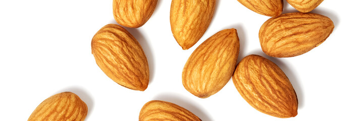Nuts almonds scattered on a white background. Isolated with shadow. Flat lay.