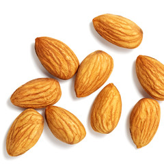Nuts almonds scattered on a white background. Isolated with shadow. Flat lay.
