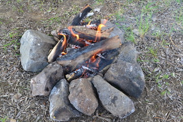 Tourist bonfire on nature in spring.