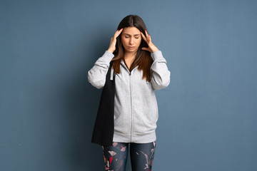 Young sport woman with headache