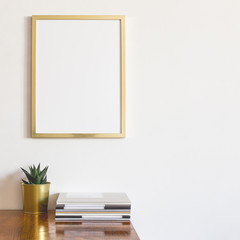 Stylish desk with gold supplies and frame mockup.