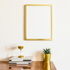 Gold frame mockup over desk with home decor