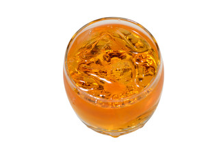 Whisky in a glass with ice pieces the top view on a white background