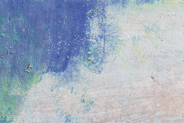 the concrete background and the bright spots of paint.