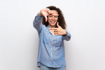 Dominican woman with striped shirt focusing face. Framing symbol