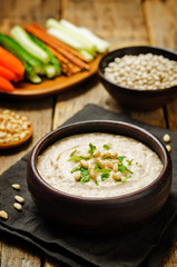 White bean hummus on a wood background