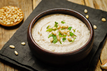 White bean hummus on a wood background