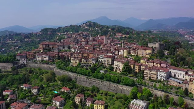 Aerial drone panoramic video of iconic old fortified upper Medieval city of Bergamo, Lombardy, Italy