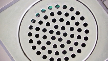 19640_Closer_look_of_the_holes_on_the_floor_in_the_bathroom.jpg