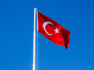 Turkish flag waving in blue sky background