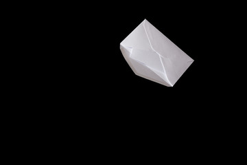 white envelope tied with a rope, falls on a black background