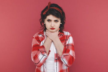 Woman feeling sick and holding hands on the neck