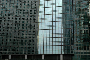 Fototapeta na wymiar Office towers with reflections in Hong Kong