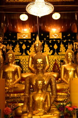 Fototapeta premium Golden Buddha statue at Bangplee Temple, Luang Pho To Temple, Thailand The beauty of temples and Buddha images of Thai religious art