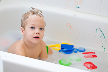 little child taking a bath