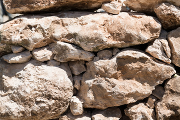 natural stone background - close up of muretto a secco - old traditional Apulian architectural art, Salento, Puglia
