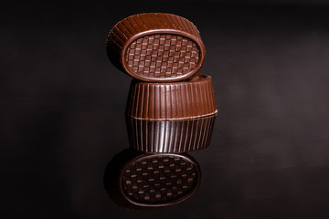 Chocolate on glass with reflection. It can be used as a background