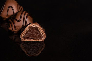 Chocolate on glass with reflection. It can be used as a background