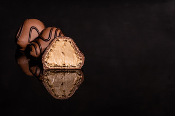Chocolate on glass with reflection. It can be used as a background