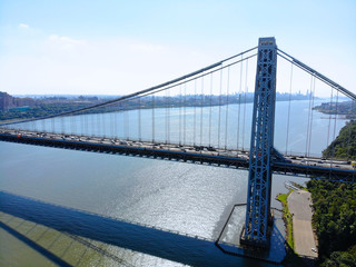 Aerial view of George Washington Bridge in Fort Lee, NJ. George Washington Bridge is a suspension bridge spanning the Hudson River connecting NJ to Manhattan, NY. Panorama of GWB during summer