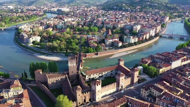 Aerial drone panoramic video from Castelvecchio castle in iconic city of Verona, Adige river and fortified medieval castle of Castelvecchio, Verona, Italy
