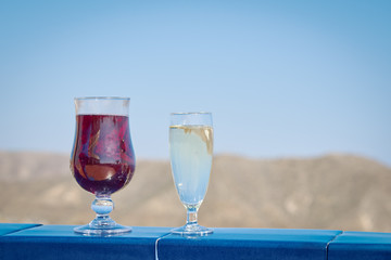 Enjoying the honeymoon. Two wineglasses against the picturesque mountain view.