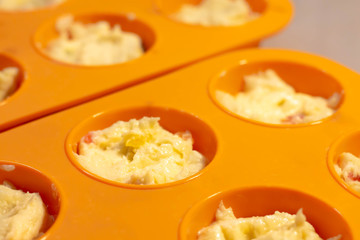 cake dough in silicone pan prepared to be put to the oven for baking