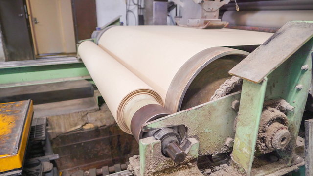20713_A_big_roll_of_white_sheet_of_paper_on_the_machine_in_Rapina_Estonia.jpg