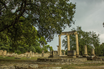 soft focus ruined stone building and columns object from ancient Greece times, park outdoor...