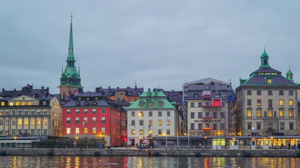 Fototapeta premium 21308_Lights_turned_on_inside_the_buildings_in_Stockholm_Sweden.jpg