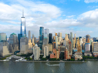 Fototapeta na wymiar Stunning aerial view of Manhattan Skyline, with World Trade Center, New York, USA. Panoramic skyline with skyscrapers and financial district and Hudson river, New York, USA