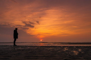 silhouette of a man at sunset